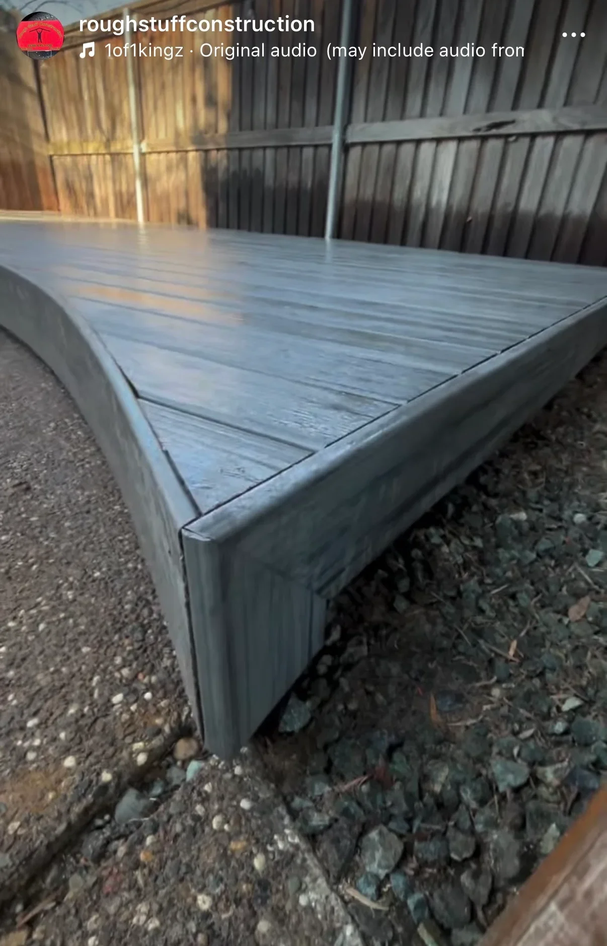 Gray composite deck boards with steel fascia trim and metal frame structure